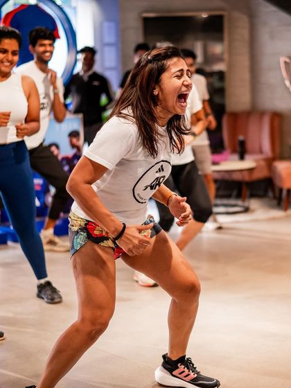 The raw energy of a group workout. This is me giving it my all during a high-intensity session with the team. The collective energy is contagious.