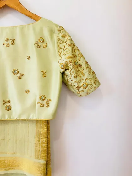 A duplicate image of the elegant pistachio green hand-embroidered blouse.
