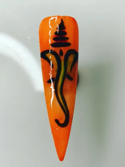 Another style of hand-painted Ganesha, showing a different artistic interpretation. I can create various styles of spiritual and cultural nail art based on what you have in mind.
