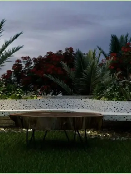This design concept features built-in terrazzo seating surrounded by lush, tropical plants. A rustic log table adds a natural, organic element, showing how we mix modern and natural materials to create a balanced landscape.