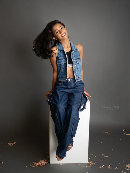 A joyful hair flip. This dynamic black and white shot captures her fun-loving spirit and the energy of being eleven.