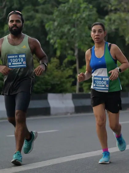 Runners participating in the Green Milers Run in Delhi. I organize events focused on promoting environmental awareness and green initiatives.