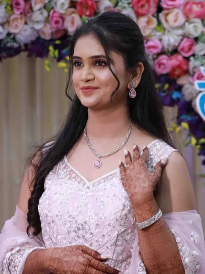 The complete Ring Ceremony look. The soft pink outfit is paired with glowing skin and a matching pink lip, creating a cohesive and beautiful appearance.