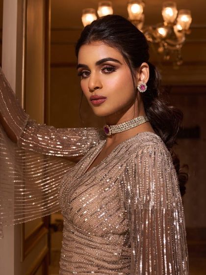 A beauty shot focusing on the makeup and jewelry for this engagement look. A simple diamond choker and earrings were all that was needed to complement this showstopping gown.