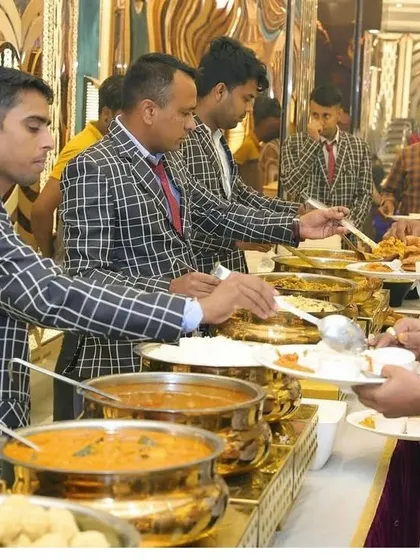 A shot of the bustling buffet line at Grand Utsav Banquet hall in Kharghar. I ensure the catering service is smooth and the food is delicious, whether it's a veg or non-veg menu.