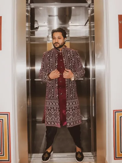 Even the elevator ride is a photo opportunity in this majestic sherwani.