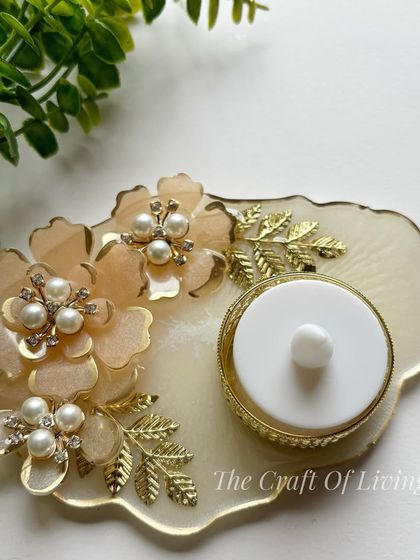 A beautiful resin tea light holder with delicate, handcrafted resin flowers. This piece combines the charm of nature with the sleek finish of resin for an elegant decor accent.
