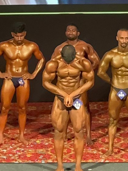 An abdominal and thigh pose, showing off the deep cuts and separation that only come from a disciplined prep.