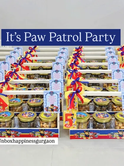A wide shot of the 'Paw Patrol' party favors, showing the fun and energetic theme that kids love.