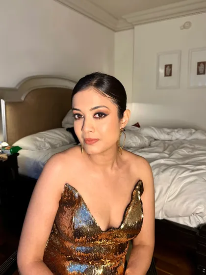 A chic and modern makeover for Harshi Gupta. This look features a graphic winged eyeliner and clean, glowing skin for a minimalist yet high-impact effect.