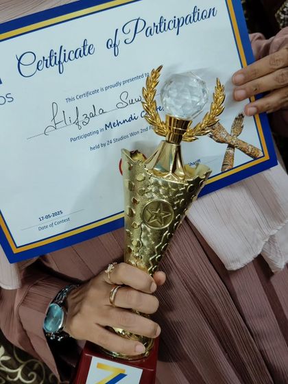 Another shot of my certificate of participation and trophy. Every competition is a chance to learn and grow as an artist.