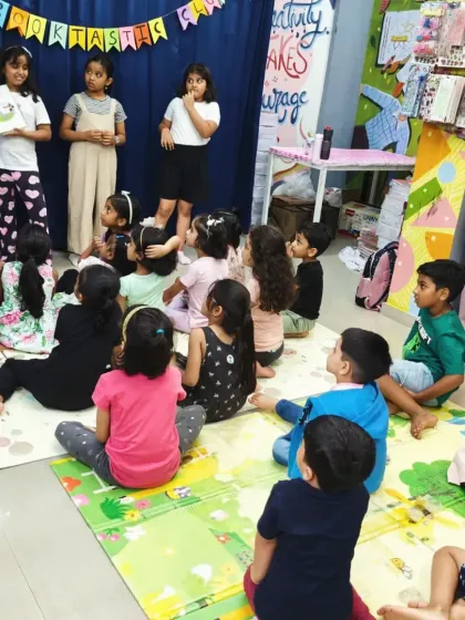 Another view of our young storytellers presenting 'Pete the Cat'. They work as a team to narrate the story, building their confidence and public speaking skills in a supportive environment.