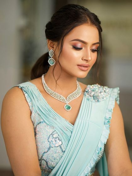 A serene, eyes-closed portrait that focuses on the soft, shimmery eyeshadow and the overall elegance of the look.