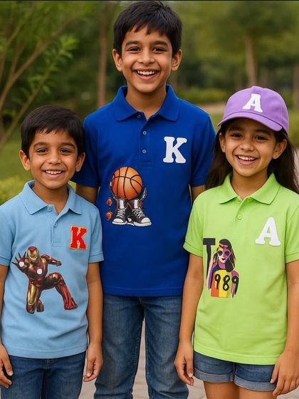 A trio of happy kids in their personalised polo t-shirts. We offer a range of themes from superheroes to sports, all customisable with names or initials.