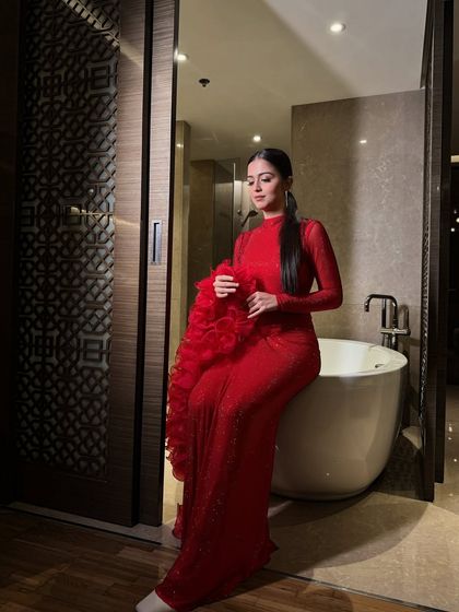 A final shot showcasing the drama and elegance of the complete red carpet look.