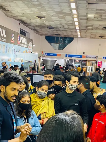 Another angle showing the dense crowd gathered to watch the performance. Consistent shows throughout the day ensure a steady flow of traffic to your booth.