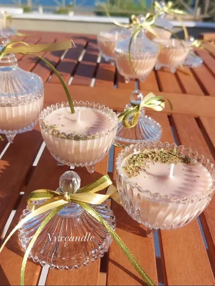 Our crystal jar candles are perfect for any elegant event, especially weddings. Here they are shown with and without lids, filled with scented wax and herbs.