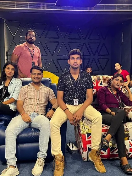 A closer look at the team enjoying our in-house media room. The custom wall panels you see are not just for looks; they are acoustic treatments that absorb echoes and improve sound clarity significantly.