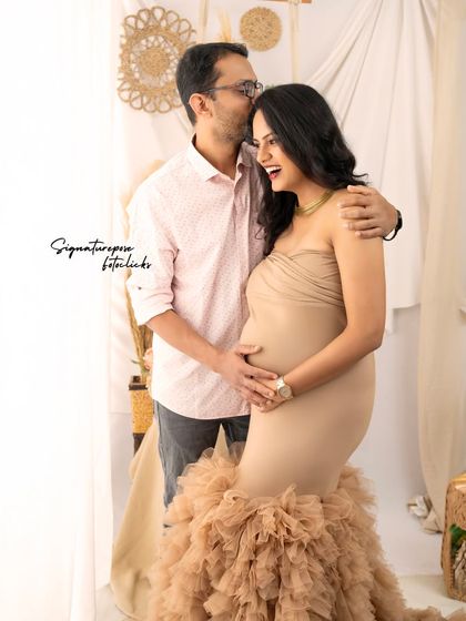 A candid and joyful moment between a couple in the boho studio, full of laughter and love.
