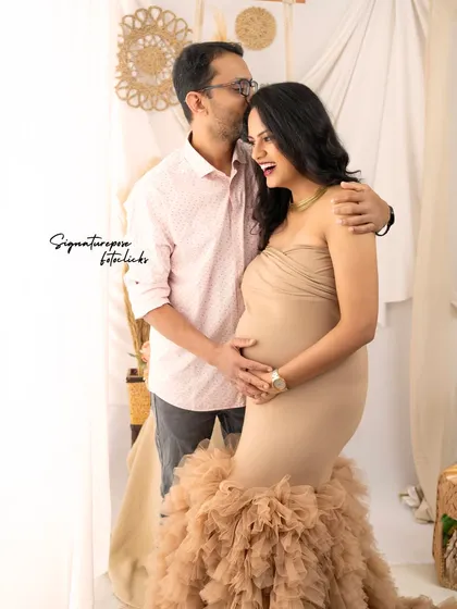 A candid and joyful moment between a couple in the boho studio, full of laughter and love.