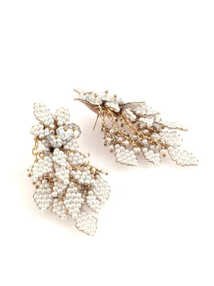 Another angle of our white beaded earrings, showing the intricate weaving and gold chain accents.