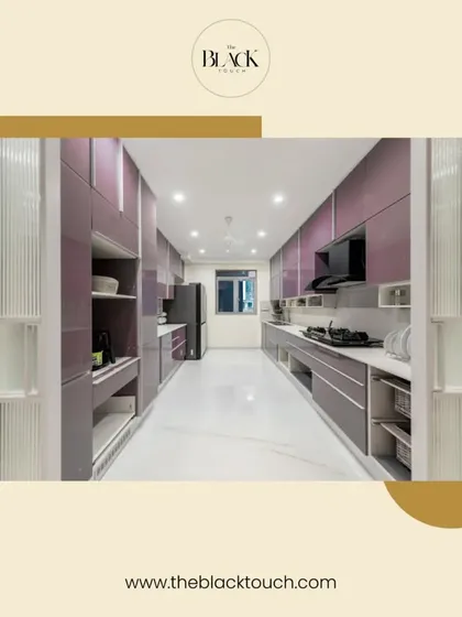 A spacious and luxurious parallel kitchen with glossy purple cabinets and fluted glass details. The design offers extensive storage and counter space, making it perfect for those who love to cook and entertain.