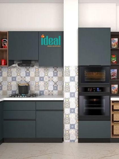 This L-shaped kitchen design combines deep teal cabinetry with warm wood accents and a patterned tile backsplash. The layout includes integrated appliances and clever storage solutions like wicker baskets, creating a space that is both stylish and highly practical.