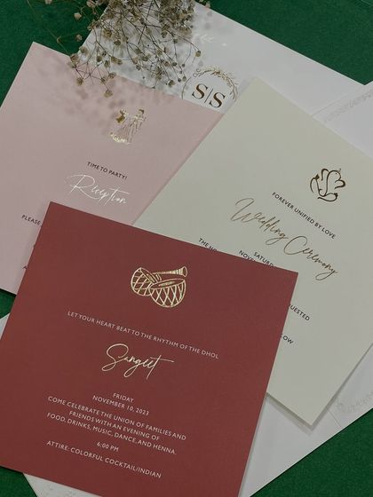 A closer look at the inserts from our classy and minimal suite. Each card for the Sangeet, Wedding Ceremony, and Reception features a unique color and a small gold-foiled icon representing the event.