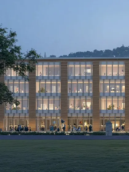 A frontal view of the North Karnataka educational institute, emphasizing the building's scale and rhythmic facade. The extensive use of glass across multiple floors is designed to flood the interior learning spaces with natural light, creating a transparent and connected atmosphere for students and faculty.