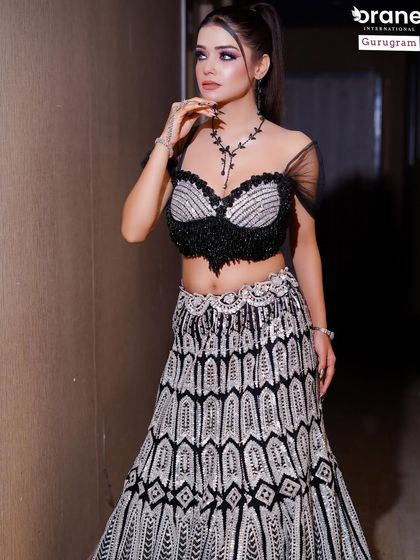The full length shot of this black and white lehenga shows a modern, edgy take on traditional wear. My students learn to push creative boundaries while maintaining elegance.