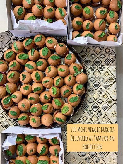 An order of 100 mini veggie burgers, delivered fresh at 9 AM for an exhibition. I can handle early morning and bulk orders for any event.