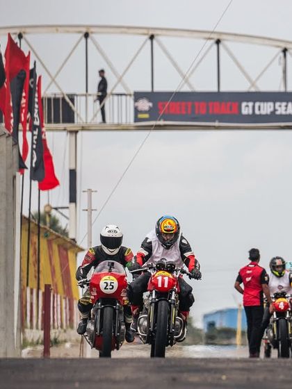 Riders head out of the pit lane for their session at the RE GT Cup. This is where street riders get their first taste of professional track racing.