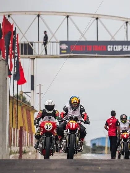 Riders head out of the pit lane for their session at the RE GT Cup. This is where street riders get their first taste of professional track racing.