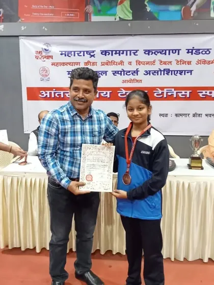 Ananya Chande receiving her U-16 girls' title at an inter-school tournament. Her success at school-level competitions is just as important to us.