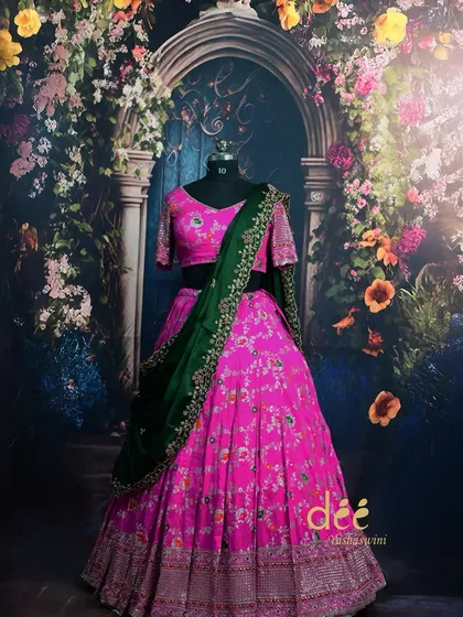 My collection isn't just about gowns. I also offer a wide range of traditional Indian wear for rent, like this beautiful pink floral lehenga with a contrasting green dupatta, perfect for weddings or festive events.
