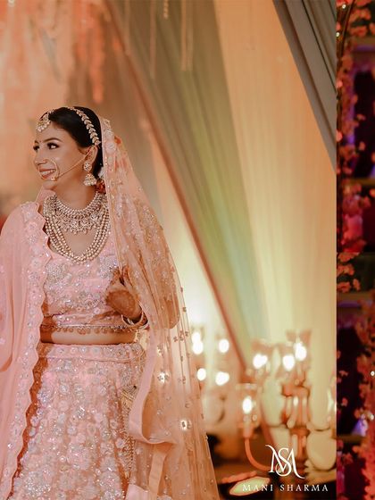 A candid shot of the bride with a beautiful, natural smile during her wedding in Jammu. These unposed moments are often the most cherished.