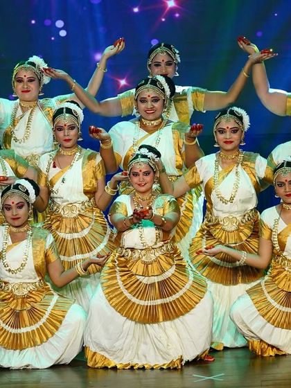 Our senior ladies' batch performing a graceful Mohiniyattam piece, their synchronized movements creating a beautiful tableau on stage.