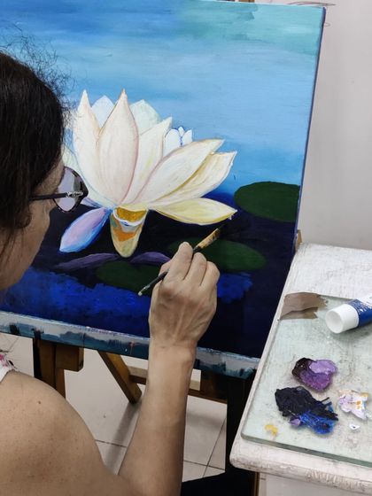 The journey of a lotus painting, from the first strokes of the background to the delicate shading on the petals.