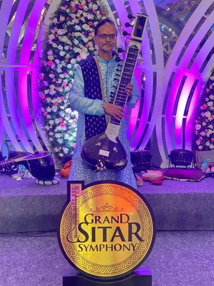 Music is my life and my devotion. Here I am with my sitar, the instrument at the heart of every composition I create.