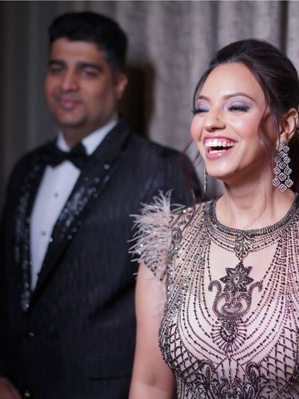 A candid shot of the bride's joyful reaction during her cocktail party or reception. Her happiness is absolutely contagious.