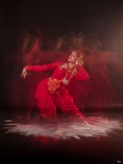 This frame feels like an explosion of energy. The combination of powder and long exposure lighting creates a dramatic effect that perfectly captures the spirit of the dance.