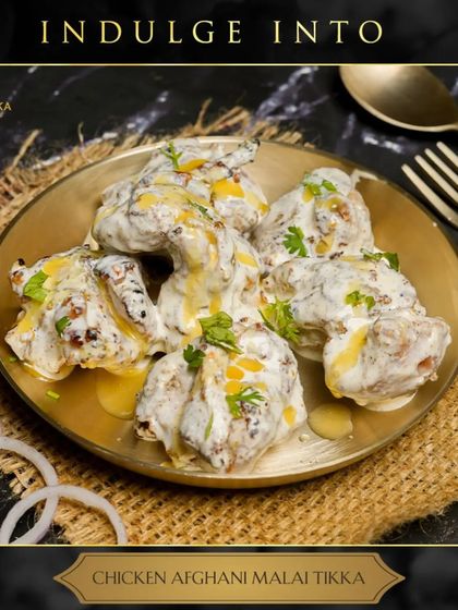Our Chicken Afghani Malai Tikka is all about melt-in-your-mouth goodness. Marinated in a rich blend of cream, cheese, and mild spices, it's a creamy and luxurious starter.