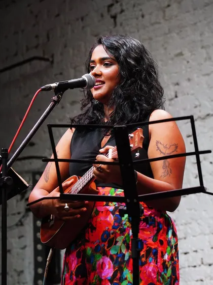 Performing solo with my ukulele at an intimate event. This setup is all about creating a personal connection through raw, honest music.