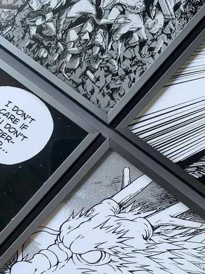 A collection of framed manga panels arranged together. The consistent gray metal frames create a unified and powerful gallery wall for any fan.