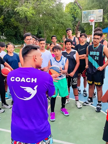 The back of my coach shirt says it all. I'm here to lead and guide this group of talented young players.