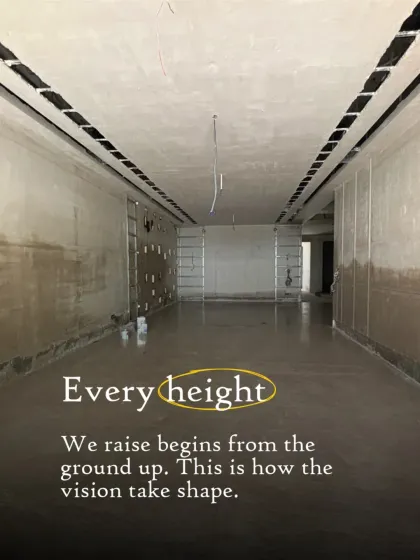 Every height we raise begins from the ground up. This image shows the expansive interior of a home under construction, where the vision for a grand living space starts to take shape.