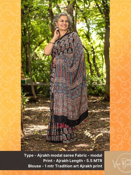 This Ajrakh modal saree features a beautiful blend of traditional wavy patterns and floral motifs. The soft fabric and earthy colors make it a sophisticated choice for any art and textile lover.