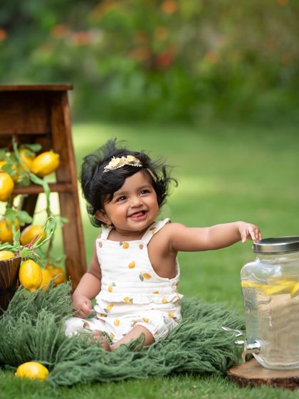 This little one is ready to serve up some smiles at her lemonade stand. Sitter sessions are so much fun with interactive themes like this.