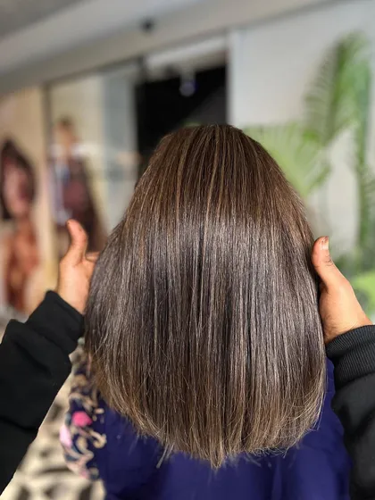A beautiful example of a straight, sleek, and shiny brown hair color. Classic and always in style.