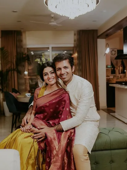 A photo of a happy client couple in their living room.